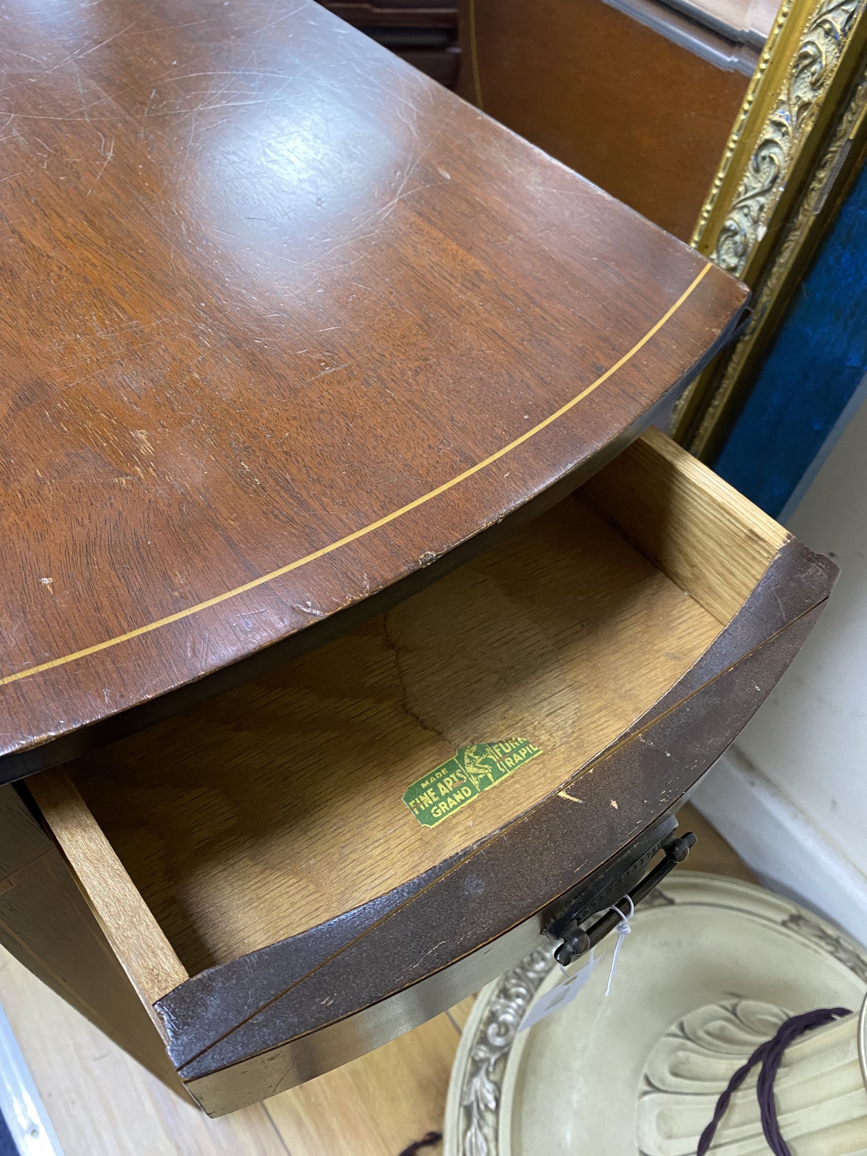 A small inlaid mahogany oval Pembroke table, width 52cm, depth 37cm, height 64cm